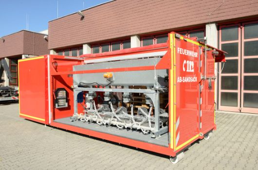 Abrollbehälter Sandsack